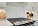 Modern gas stove with stylish backsplash and pot filler, blending functionality with design at 1988 Deco Dr, Kennesaw, GA 30144