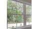 Window view showing lush green trees at 1988 Deco Dr, Kennesaw, GA 30144