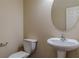 A half bathroom featuring a pedestal sink and toilet at 1623 Bradmere Ln, Lithia Springs, GA 30122