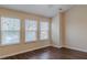 Bedroom with wood floors and three windows letting in lots of natural light at 1623 Bradmere Ln, Lithia Springs, GA 30122