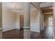 Refined dining room featuring wainscoting details, a chandelier, and hardwood floors at 1623 Bradmere Ln, Lithia Springs, GA 30122