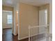 Upstairs hallway with wood floors and white railings and trim at 1623 Bradmere Ln, Lithia Springs, GA 30122