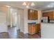 Open concept kitchen with wood cabinets, granite countertops, and stainless steel appliances at 1623 Bradmere Ln, Lithia Springs, GA 30122