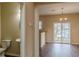 Cozy living room featuring wood floors and a sliding glass door leading to a patio at 1623 Bradmere Ln, Lithia Springs, GA 30122