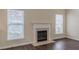 Living room with fireplace, hardwood floors and bright windows with blinds at 1623 Bradmere Ln, Lithia Springs, GA 30122