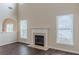 Spacious living room featuring a fireplace and large windows offering plenty of natural light at 1623 Bradmere Ln, Lithia Springs, GA 30122