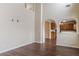 Living room with hardwood floors, neutral paint, and archway to the kitchen at 1623 Bradmere Ln, Lithia Springs, GA 30122