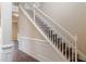 Elegant staircase with white railing and rich wood treads, complemented by detailed wall trim at 1623 Bradmere Ln, Lithia Springs, GA 30122