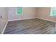 Cozy bedroom with great natural light, large windows, and gray vinyl flooring at 1417 Iris Lake Rd, Mcdonough, GA 30252