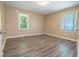 Bright and airy bedroom with a large window, and gray vinyl floors at 1417 Iris Lake Rd, Mcdonough, GA 30252