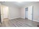 Bright bedroom features light gray walls and durable gray wood-look vinyl flooring at 1417 Iris Lake Rd, Mcdonough, GA 30252