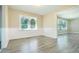 Sun-filled dining room with chair rail and durable gray wood-look vinyl flooring at 1417 Iris Lake Rd, Mcdonough, GA 30252