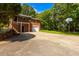 Brick home with a garage, basketball hoop, and a private staircase leading to a balcony at 1417 Iris Lake Rd, Mcdonough, GA 30252