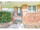Inviting front entrance showcasing a brick facade, stairs, and a door with glass at 1417 Iris Lake Rd, Mcdonough, GA 30252