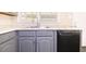 Kitchen featuring granite countertops, stainless steel appliances and gray cabinets at 1417 Iris Lake Rd, Mcdonough, GA 30252