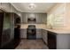Kitchen featuring granite countertops, stainless steel appliances and gray cabinets at 1417 Iris Lake Rd, Mcdonough, GA 30252