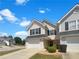 Inviting two-story home featuring a one-car garage and manicured landscaping at 201 Gallant Se Ln # 25, Mableton, GA 30126