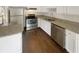Well-appointed kitchen with stainless steel appliances, granite countertops, and dark wood floors at 201 Gallant Se Ln # 25, Mableton, GA 30126