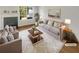 Cozy living room featuring a fireplace, plush seating, and bright natural light at 201 Gallant Se Ln # 25, Mableton, GA 30126