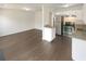Spacious living area featuring hardwood floors and flows into kitchen with stainless steel appliances at 201 Gallant Se Ln # 25, Mableton, GA 30126