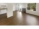 Bright living room featuring hardwood floors, fireplace, and access to the patio through glass doors at 201 Gallant Se Ln # 25, Mableton, GA 30126
