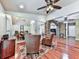 Open-concept living and dining area with hardwood floors and stone archway at 1012 Jubilee Way, Powder Springs, GA 30127