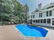 Beautiful in-ground pool with stone hot tub and large yard area at 1012 Jubilee Way, Powder Springs, GA 30127