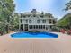 Inviting backyard features a sparkling pool and deck, perfect for outdoor enjoyment at 1012 Jubilee Way, Powder Springs, GA 30127