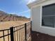 View of the backyard, featuring a black metal fence and a glimpse of the neighborhood beyond at 3577 Fishpond Cir, Dacula, GA 30019