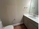 Powder room featuring modern fixtures and wood look flooring at 3577 Fishpond Cir, Dacula, GA 30019
