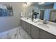 Primary bathroom featuring double sinks, lots of countertop space and a large mirror at 3577 Fishpond Cir, Dacula, GA 30019