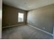 Neutral bedroom with carpet, a window, and an electrical outlet at 3577 Fishpond Cir, Dacula, GA 30019