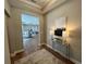 Foyer featuring a stylish console table, lamps, artwork, and beautiful hardwood floors at 3577 Fishpond Cir, Dacula, GA 30019