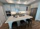 Open kitchen features a large center island with seating and stainless steel appliances at 3577 Fishpond Cir, Dacula, GA 30019