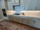 Stylish kitchen showcasing subway tile backsplash and sleek, light gray cabinetry at 3577 Fishpond Cir, Dacula, GA 30019