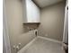 Convenient laundry room with upper cabinets at 3577 Fishpond Cir, Dacula, GA 30019