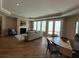 Spacious living room with a fireplace, plenty of natural light, and hardwood flooring at 3577 Fishpond Cir, Dacula, GA 30019