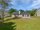 Well maintained backyard with ample green space and a rear patio perfect for outdoor living at 424 Eglington Trl, Locust Grove, GA 30248