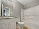 Bathroom featuring granite countertop, a bathtub, and modern fixtures at 424 Eglington Trl, Locust Grove, GA 30248