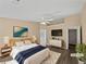Cozy bedroom featuring a ceiling fan, hardwood floors, and neutral walls at 424 Eglington Trl, Locust Grove, GA 30248