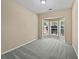 Cozy bedroom features plush carpet, large bay windows, and neutral color palette at 424 Eglington Trl, Locust Grove, GA 30248