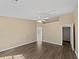 Large bedroom featuring a ceiling fan, hardwood floors, and neutral walls at 424 Eglington Trl, Locust Grove, GA 30248