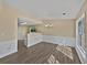 Bright dining room features stylish chandelier, chair rail, and durable wood floors at 424 Eglington Trl, Locust Grove, GA 30248