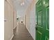 Inviting hallway with hardwood floors, neutral walls, and an open view to the living room at 424 Eglington Trl, Locust Grove, GA 30248
