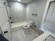 Updated bathroom with a shower/tub combo, toilet, and modern vanity at 2040 Penelope Nw St, Atlanta, GA 30314