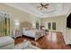 Luxurious main bedroom with sitting area and access to deck at 10700 Stroup Rd, Roswell, GA 30075