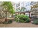 Serene courtyard featuring modern sculpture, pergola, and manicured landscaping, creating a peaceful outdoor retreat at 1850 Cotillion Dr # 3123, Dunwoody, GA 30338