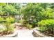 Lush courtyard with a quaint wooden bridge and a variety of greenery, creating a serene and inviting outdoor space at 1850 Cotillion Dr # 3123, Dunwoody, GA 30338