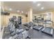 Well-equipped fitness center featuring modern cardio machines, weights, and mirrored walls, promoting a healthy lifestyle at 1850 Cotillion Dr # 3123, Dunwoody, GA 30338
