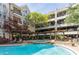 Beautiful outdoor pool and hot tub area with seating and lush landscaping near the condo complex at 1850 Cotillion Dr # 3123, Dunwoody, GA 30338